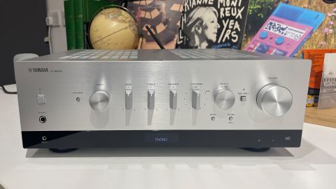 Yamaha R-N800A streaming amplifier on white shelf with busy background